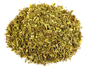 Pile of dried thyme herb seasoning on white surface