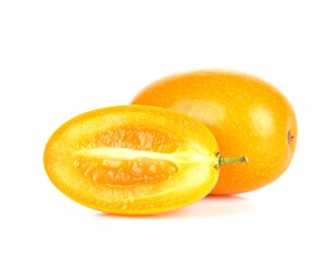 Fresh kumquats displayed cut open showing juicy interior on white background
