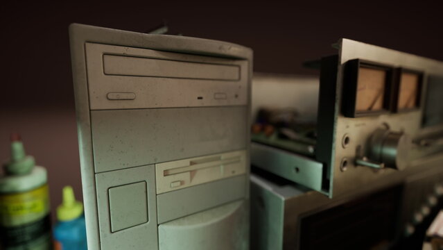 Dusty computer and audio equipment sit together in a dimly lit room. The worn surfaces and faded colors evoke memories of a different time in technology history and personal entertainment.