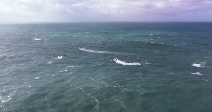 Jet ski pathfinding through giant Nazar&eacute; swells, aerial drone view