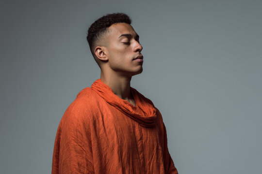 professional man wearing glasses sits at sleek desk focused intently on his tablet device