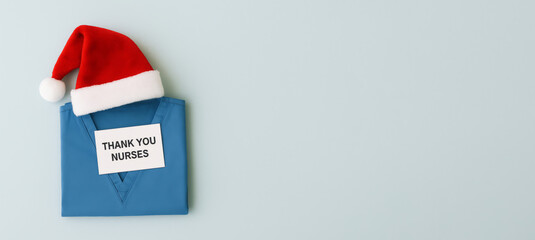 Christmas medical wellness concept with nurse uniform and festive hat, copy space