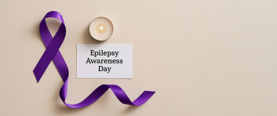 Epilepsy awareness day concept with purple ribbon candle and card, background