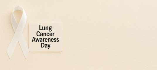 Lung cancer awareness day concept with ribbon on neutral background