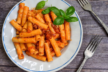  Pasta bolognese .Italian home made meal Fresh   maccheroni pasta with tomato sauce, basil, herbs ,parmesan cheese ,fresh cherry tomatoes and parsley on wooden background. Kitchen Poster 