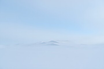 Mountain peaks emerging from a sea of clouds creating a serene and ethereal landscape