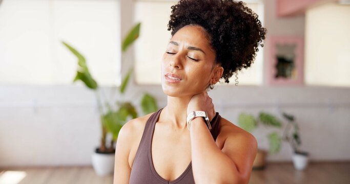 Woman, discomfort and neck pain in class from pilates accident, inflammation and cramp. African person, ache and spine injury from fitness, muscle sprain and exercise mistake from burnout risk