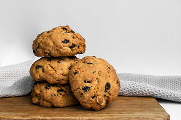 Stack fragrant, delicious cookies with raisins and nuts. Homemade baking. Photo for articles, blogs and recipes.