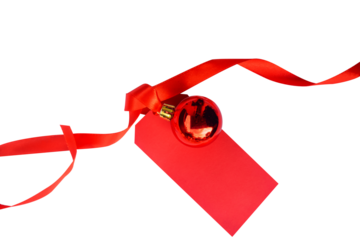 christmas ball decoration with red curly ribbon and blank label tag isolated on transparent background