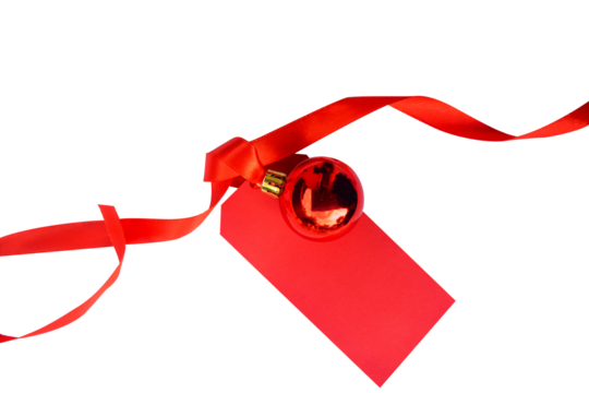 christmas ball decoration with red curly ribbon and blank label tag isolated on transparent background