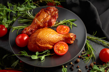 Smoked chicken drumsticks with greens and vegetables.