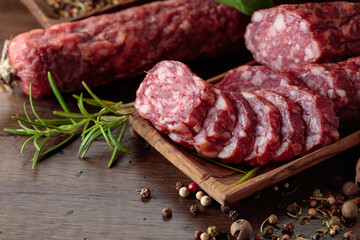 Sliced smoked sausage with herbs and spices.