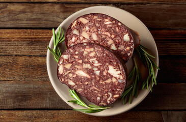 Black pudding or blood sausage accompanied by rosemary.