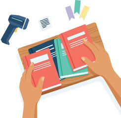 Hands organizing colorful books on a tray, with labels and a barcode scanner nearby