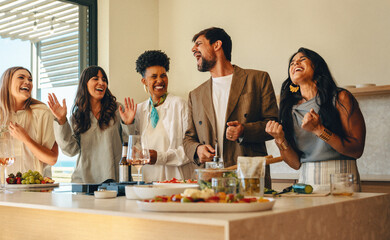 Friends enjoying a dinner party with laughter and good vibes