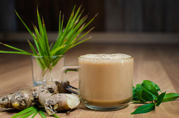
Green Ginger Tea and Ginger Milk Tea in Glass Cups – Traditional Herbal Drink with Fresh Ginger, Healthy Beverage Concept
