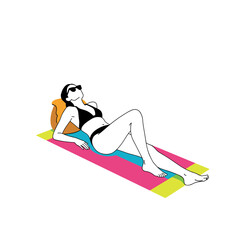 A woman in sunglasses and a bikini lies on a colorful beach towel with her head resting on a pillow soaking up the sun.