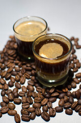 resh Roasted Coffee Beans with Espresso in Glass Cup on Wooden Table – Aromatic Coffee Concept with Natural Decor for Café, Beverage, and Food Photography