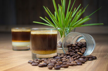 resh Roasted Coffee Beans with Espresso in Glass Cup on Wooden Table – Aromatic Coffee Concept with Natural Decor for Café, Beverage, and Food Photography