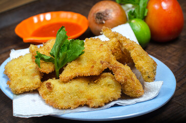Crispy Fried Fish Fillets on Plate – Golden Breaded Seafood Snack with Fresh Ingredients, Delicious Asian Homemade Dish, Close-Up Food Photography