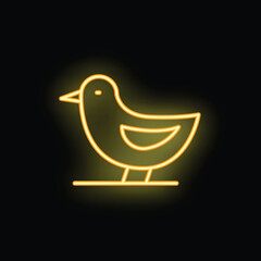 Yellow neon sign of a cute bird standing on a branch, glowing on a black background