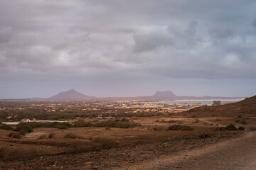 Panoramic view from a dirt road in the Cape Verdean desert with the city of Boa Vista ,Cape Verde.