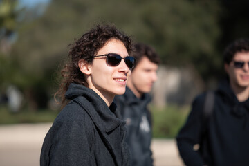group of joyful friends raising their champagne glasses during festive christmas dinner