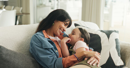 Happy, hug and mother with child on sofa in home with love, support and care in living room. Smile,...