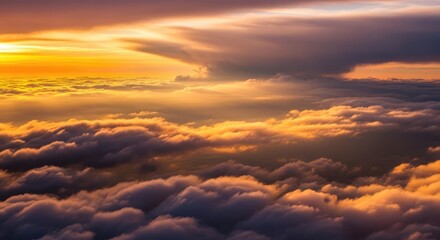 Obraz premium Stunning aerial view of a vibrant sunset over a sea of clouds