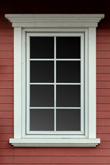 Fototapeta premium Classic white framed window on red horizontal wooden plank wall texture background for architectural design.
