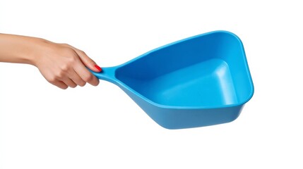 A close-up of a woman's hand holding a bright blue laundry detergent scoop isolated on a clean white background, emphasizing simplicity and utility