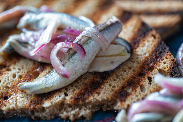 Alici in saor, marinated anchovies with red onions.