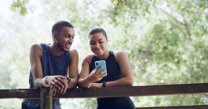 Hiking, nature and couple with cellphone on bridge, outdoor exercise or digital map for trail navigation. Fitness, step counter and people with mobile location app, fauna or flora research from below