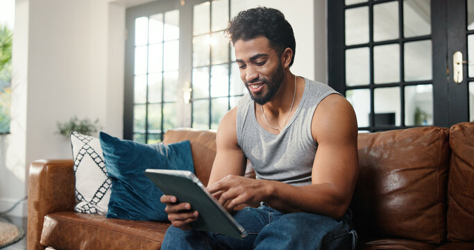 Relax, scroll or man with tablet on couch, check social media or browsing movie selection on website. Subscription service, film and person chilling in home with tech, watch video or streaming choice