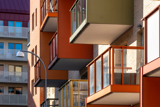 Dynamic architecture featuring modular housing forms across an urban streetscape of contemporary sweden, stockholm, stora ursvik distinguished by residential facade contrast