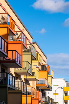 Stacked architecture and bold housing geometry forming an urban scene of contemporary sweden, stockholm, stora ursvik highlighted with residential facade contrast