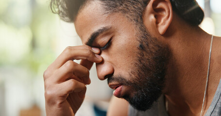 Home, headache and man with pain, tired and stress with challenge, frustrated and eye strain. Apartment, migraine and person in lounge, burnout and overwhelmed with tension, fatigue and exhausted