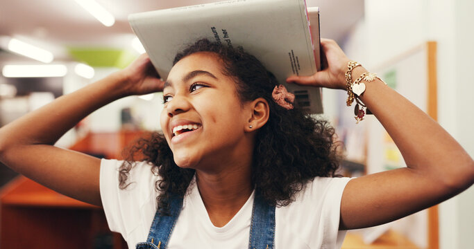 Smile, child and student with books in library for learning, story time and literature education. Happy, kid and walk with novel for studying, language development and scholarship of knowledge growth