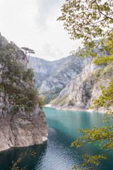 Cliff on the shore of the lake. Lake Piva in Montenegro