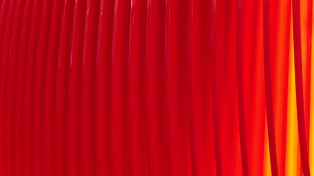 Red vertical elements creating an abstract pattern with a gradient light on the right