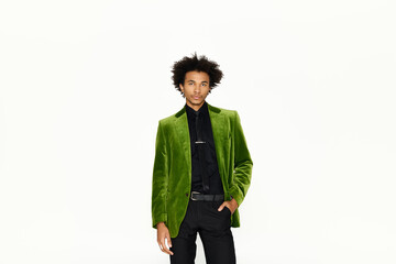 Elegant young man exudes charm in vibrant green attire for a fashion showcase