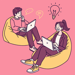 Two young coworkers sitting with laptops and discussing ideas in a relaxed creative workspace