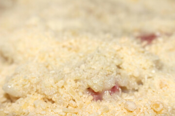Grated cheese topping risotto. cheese on creamy rice dish. Cheese with risotto and blurred background. Grated cheese over the risotto.