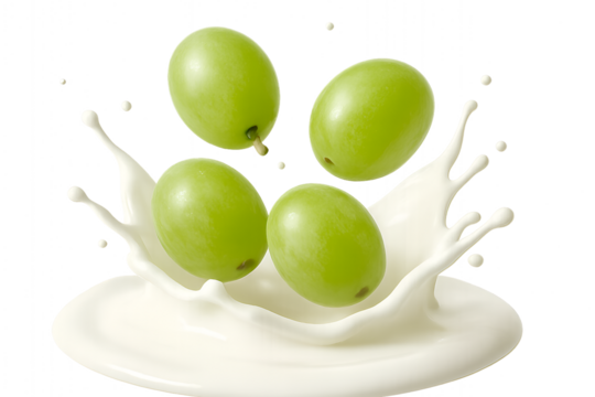 Green grapes splashing into fresh milk isolated on transparent background healthy fruit concept