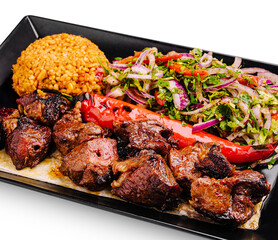 Delicious grilled meat platter served with rice and fresh salad