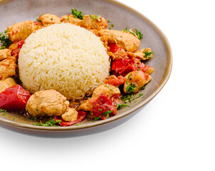 Delicious chicken and rice dish served with fresh vegetables and herbs