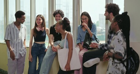 Indian young adult gen z happy boy girl pupil talk casual gossip share blab enjoy new day spend break time campus place African teen male female group team guys speak funny do joke have fun joy - Powered by Adobe