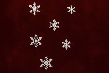 Elegant snowflakes on red backdrop background