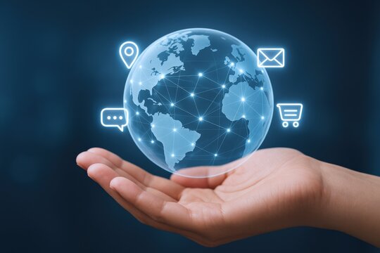 Global communication network concept: Hand holding glowing planet with digital icons representing connection and technology