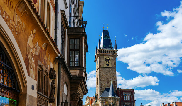 Historic Prague facade and Town Hall clock. - Powered by Adobe